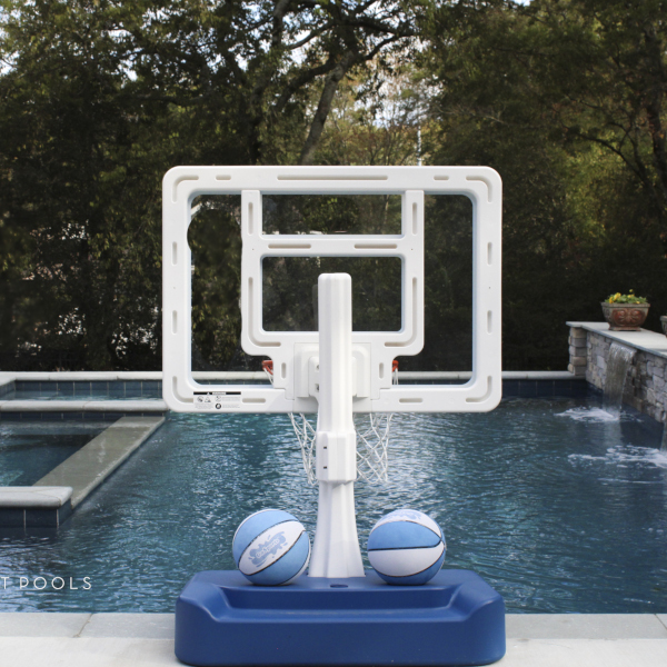 basketball hoop alongside pool